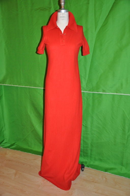 This True American classic! Rare Halston Cashmere in American Red. The back shoulder-to-shoulder measures 12 inches, the sleeves are 9 1/2 inches, and the circumference is 7 inches. The center back measures 59 1/2 inches, and the front center