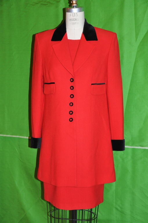 This lovely Therese Brumaire, of Paris,  two-piece dress with matching coat is in red wool crepe with black velvet detailing. Both pieces are fully lined in red. The short-sleeve dress front center measures 32 1/2 inches in length, and the back