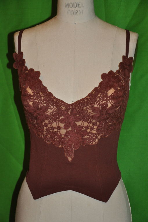The Bustier has hand embroidery in front. The back zipper is 10