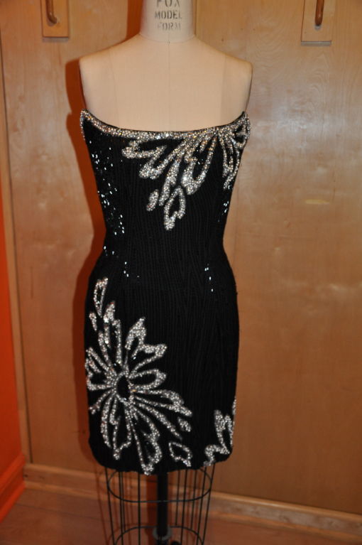 The iconic costume designer to Cher Bob Mackie designed this strapless dress for both cocktail parties and afterward, double as a disco party dress! Elegant, yet sexy, the dress is fully lined in black silk chiffon. The black chiffon dress is