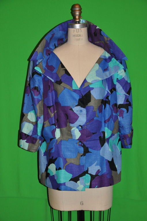 Pauline Trigere abstract jacket is fully lined with three quarters sleeves. Shade of blues, purples, taupe, violets and blacks makes for a wonderful combination of colors. The three-quarter sleeves are cuffed. the front three (3) buttons are also