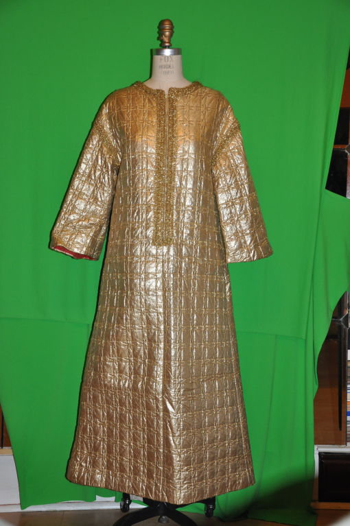 Edie gladstone gold metallic caftan has finely detailed hand embroidery work along the from center and also where the sleeves and shoulder meet.There are two side pockets. The sleeves are slightly bell shaped. The sleeves measures 17 1/2 inches;,