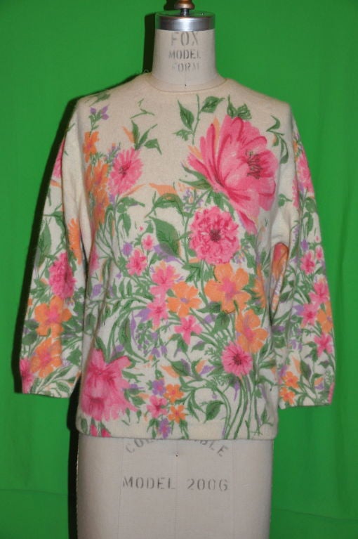 This floral print sweater is exclusively all hand-screen printed by darlene of usa. The blend is 50% French Angora rabbit hair, 40% lambswool, and 10% nylon. The center back zipper measures 7