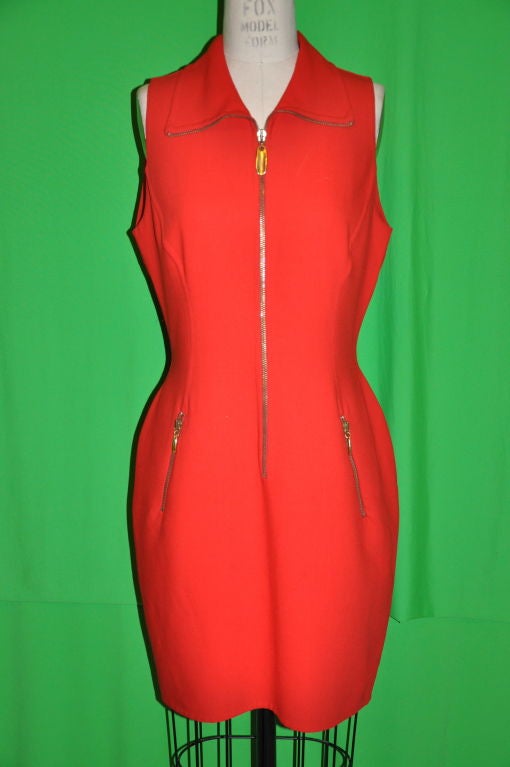 Donna Karan black-label neon red zipper front dress has detailed boning on both front and back. French seams were used in putting this wonderfully made dress, and the zipper has a gilded gold tone embellishment. There are two front pockets measuring