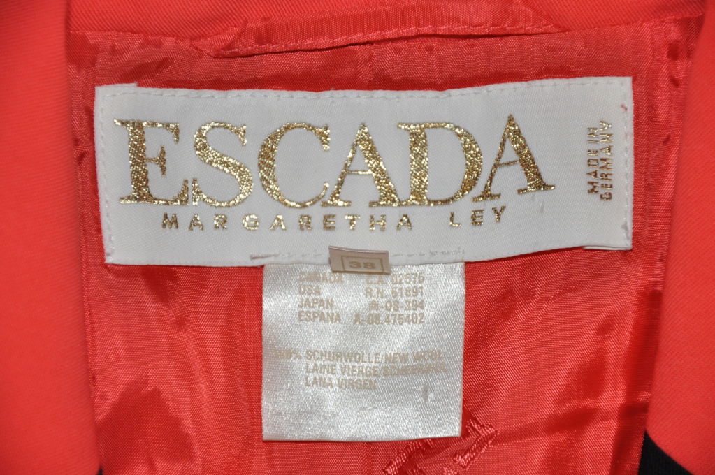 red suit jacket with black trim