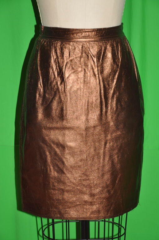 Emanuel Ungaro metallic bronze leather skirt is butter soft lambskin and fully lined. The center back zipper is 7