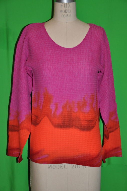 Issey Miyake top are in shades of fuchsia, tangerines, and reds.<br />
Front measures 17 1/4