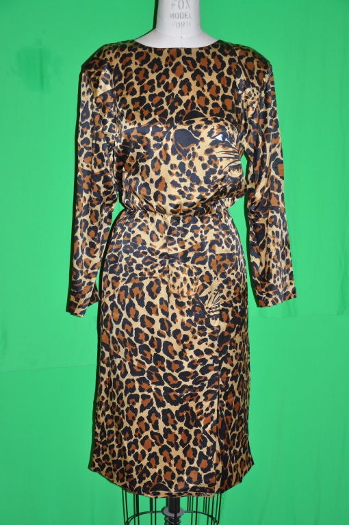 Yves Saint Laurent silk crepe de chine leopard print dress. On the front, there is a 'off-centered front fold-over slit (17 1/2 inches;) 3 3/4 inches; wide over flap. Back center zipper measures 23 1/4 inches;.Neck-to-shoulder is 5 1/2 inches,