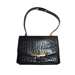 Koret Black embossed calfskin crocodile adjustable handbag.