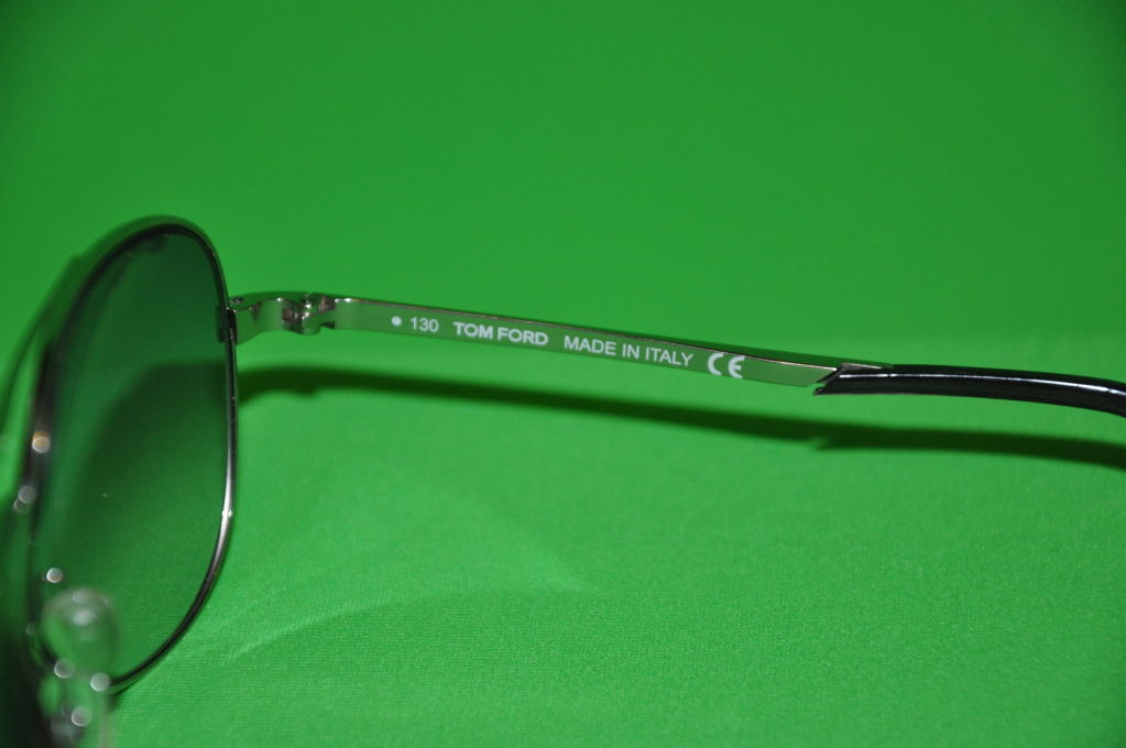 Gray Tom Ford gold metal frame sunglasses
