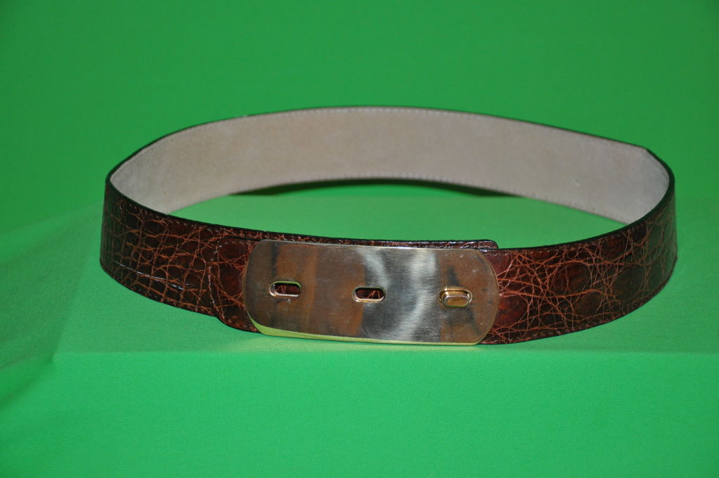 Bottega Veneta embossed brown leather belt is patterned to appear like croc. Gold hardware buckle gives you three choices of lengths.Height of belt is 1 3/4