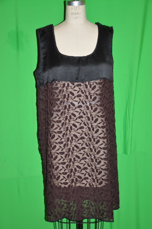 This black with brown chiffon is embroidered with black silk cord. Each shoulder strap has a three button detailing with option to open if wish, and measures 3 inches in width. On both sides, there is an 