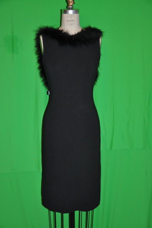Moschino black cotton spandex fitted dress has a low backside.<br />
Front measures 35