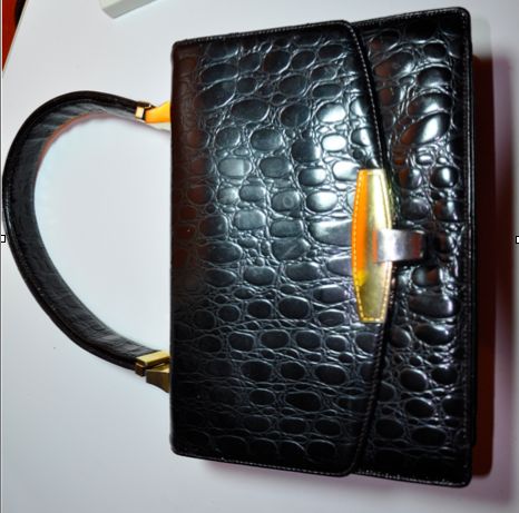 Women's Koret Black embossed calfskin crocodile adjustable handbag.
