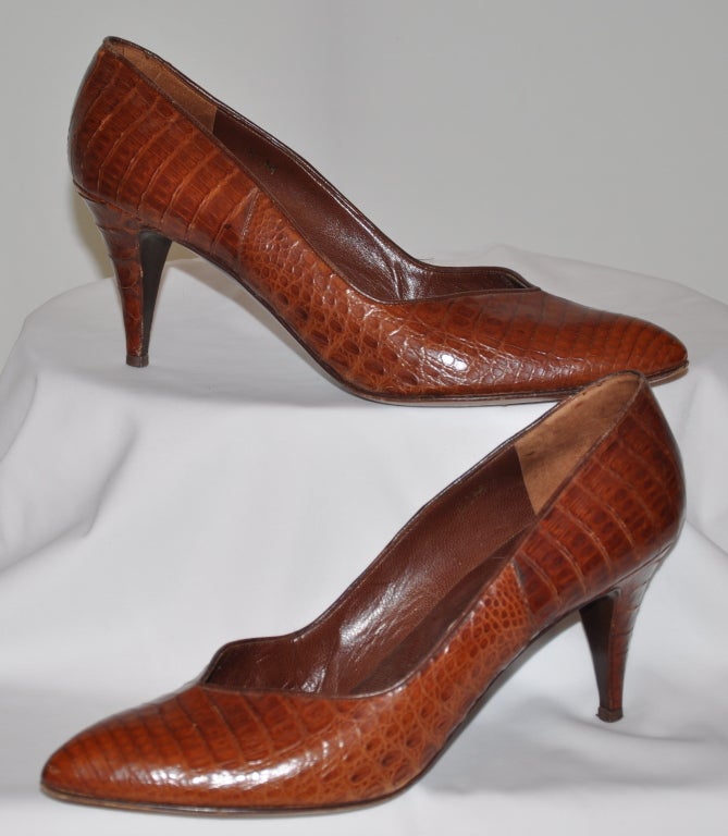 Calvin Klein alligator pumps in a warm-brown tone. Heels measures 3