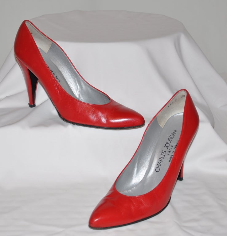 Charles Jourdan Italian-Red calf-skin leather pumps lined in silver. Hells are 4