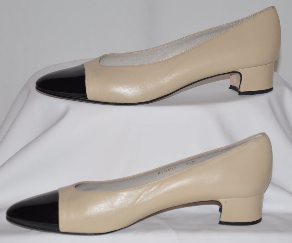 Delman beige with black-patent tip pumps