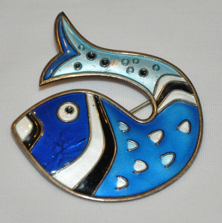 David-Anderson Fish pin is enamel over sterling silver. This whimsical fish has multi-colors finishing with a gilt layer. The pin measures 2