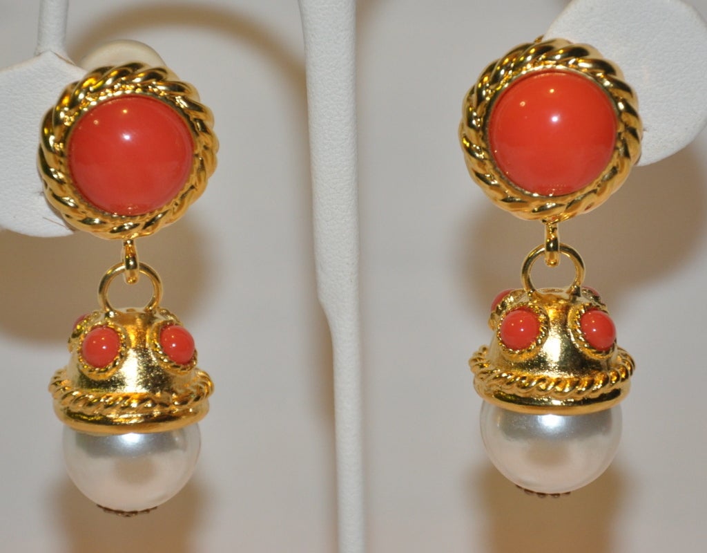 Gilded gold hardware clip-on earrings are accented with faux coral and pearl accents, giving a very polished appearance. 
   The length measures 2 1/4