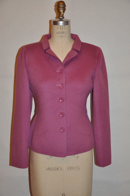 Valentino double-faced felted wool/cashmere blend in a rich lavender hue jacket has a five (5) button front. The back center peplum slit measures 5 1/2