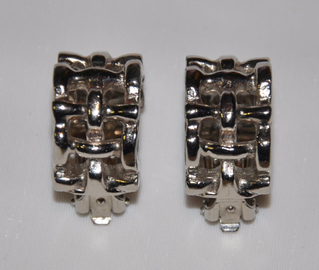 Yves Saint Laurent polished silver-toned metal ear-clips are bamboo styled. Height is 1