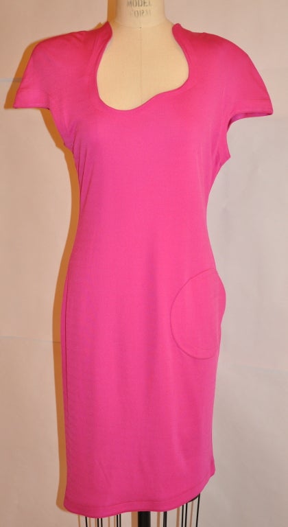      Thierry Mugler iconic signature Fuchsia hue  jersey form-fitting asymmetrically cut dress has a asymmetrical hemline also. Cap-sleeve with an invisible zipper on the center back. The zipper measures 18 1/2