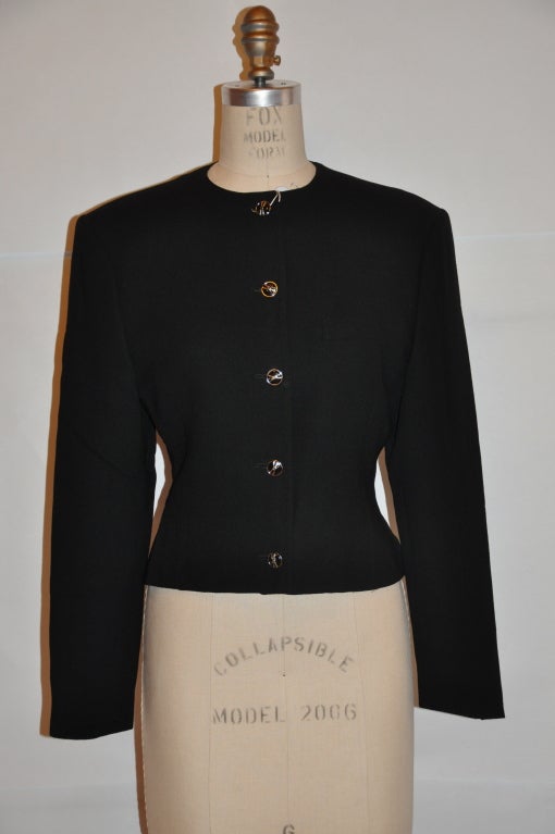 Gianni Versace black wool crepe button jacket is fully lined. The front has detailed metal buttons with 