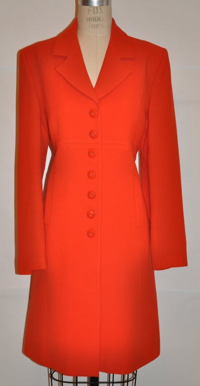 Therese Baumaire neon-orange wool crepe two-piece suit has a sleeveless shealth dress which measures 29 1/2