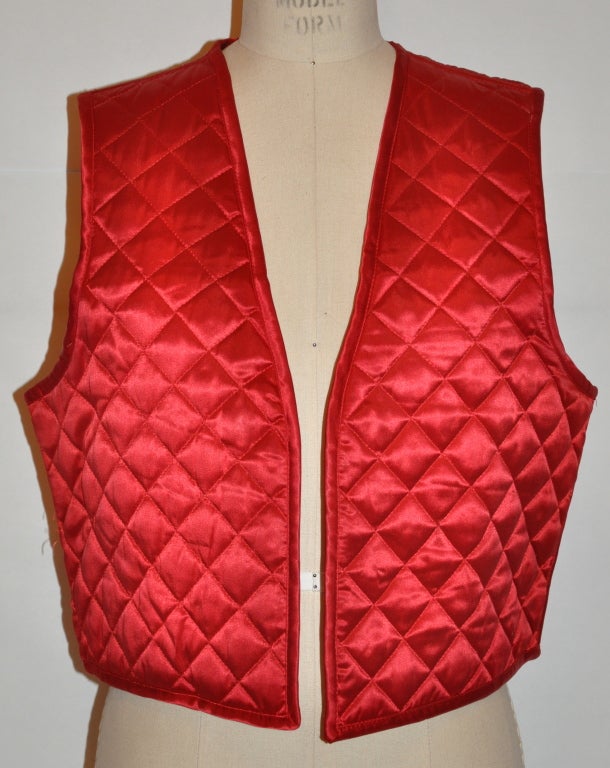 Sonia Rykiel Red quilted vest has a center back strap detail which measures 9