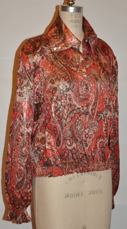Rose-Marie Roussel silk lame paisley print pullover weights like a feather. The waistband and cuffs are elastic in detail and the shoulder are slightly 