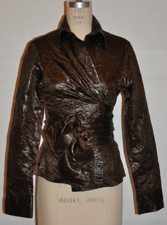 Silvia Tcherassi coco-brown silk wrap-tie top has a high-shine finish to the silk.  The sleeves are cuffed measuring 3