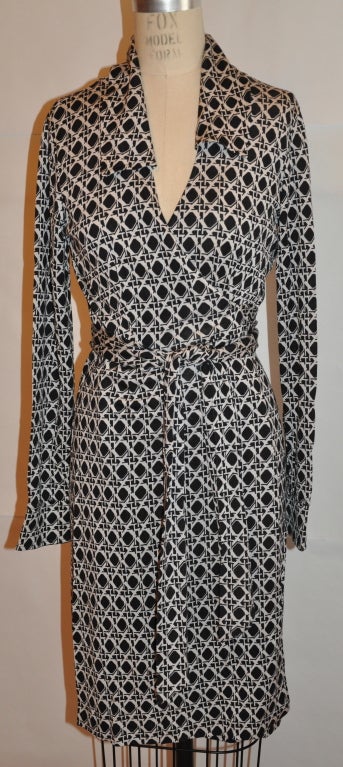 Diane Von Furstenberg Original classic wrap dress has geometric print in black and white.
   The back length is 38