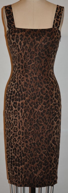 Dolce & Gabbana leopard print body-hugging dress is made from 90% silk & 10% spandex blend. Lightweight and perfect to pack for traveling. The leopard print is in hues of browns. There's a invisible side zipper which measures 15 1/2