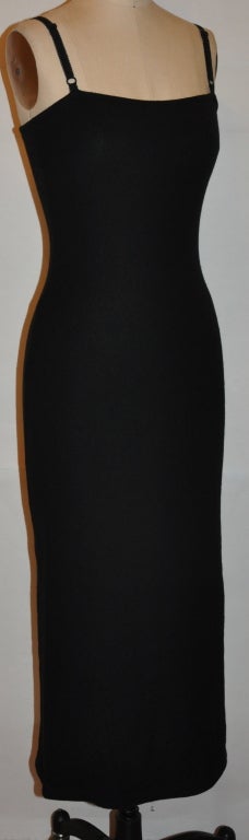 Dolce & Gabbana black wool jersey body-hugging dress has adjustable shoulder straps. The shoulder straps measures 14 1/2