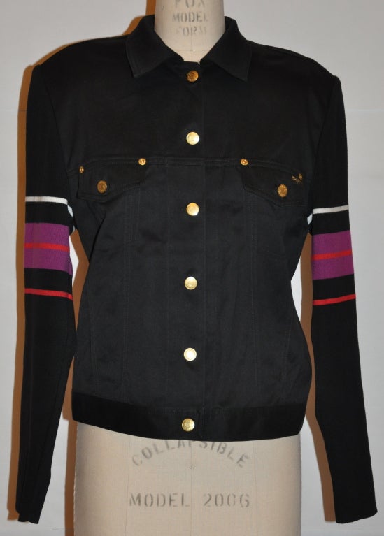 Sonia Rykiel black soft cotton jacket has multi-colored cotton-knit sleeves. There are two front breast pockets with top-stitched detailing. The sleeves are cotton knit with colors of red, fuchsia, and white. The shoulders are slightly