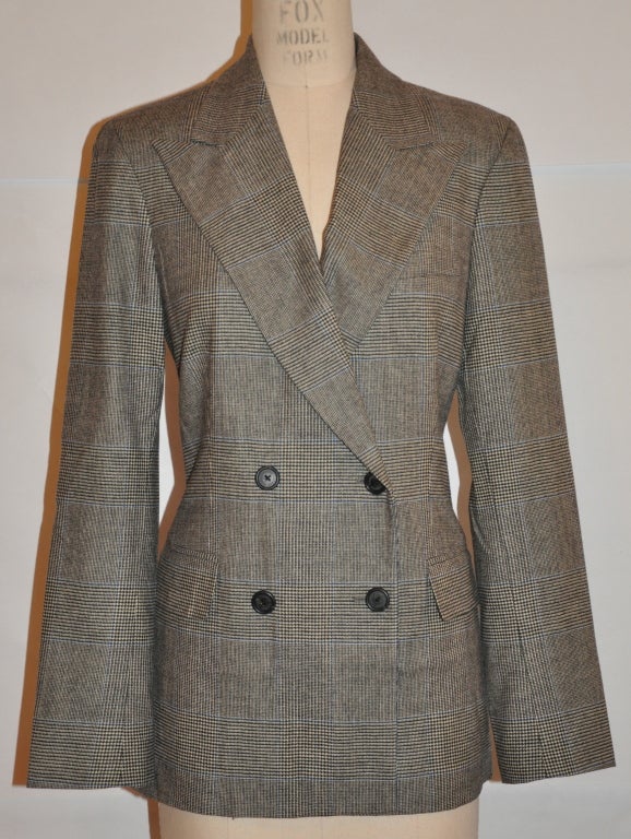 This classic Ralph Lauren Spring wool jacket is wonderfully lightweight in a charcoal-gray plaid. The fully-lined jacket is double-breasted with two set-in pockets. There are four buttons on the cuffs for detailing. This jacket is classic Ralph