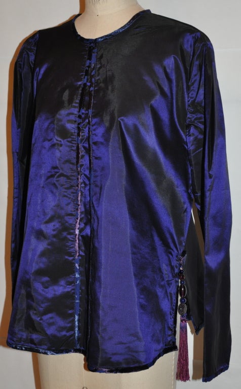 Sanchez deep-plum silk tunic has silk tassles details on the side 'open' slits. The front has hand-sewn chiffon & velvet piping. Above the side 'open' slits are embellished with a hand-made twirl with glass beads and silk twisted cord on top of the