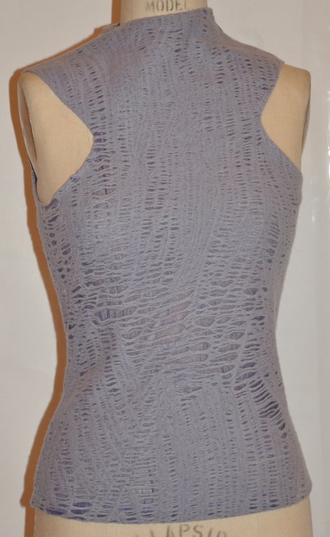 Gianni Versace lavender angora blend open-weave top has an invisible zipper on the left shoulder which measures 3 1/4