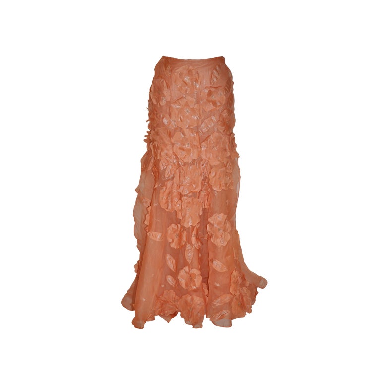 Peach silk organza skirt with floral patches.
