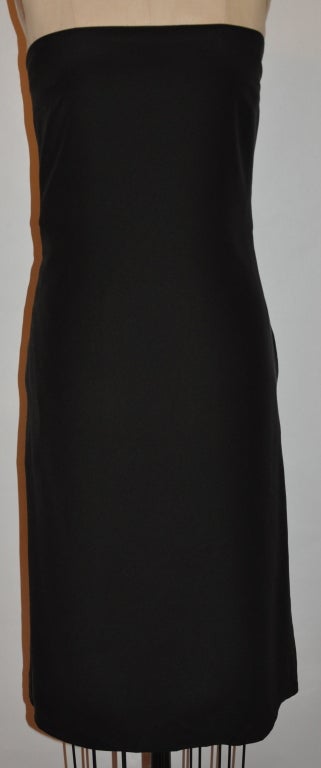 Calvin Klein black strapless cocktail dress is fully lined with silk. There are boning on both sides for a better fit and comfort. Underneath the strapless dress is a hidden strapless bustier with eight (8) hook-&-eye. The dress has a center back
