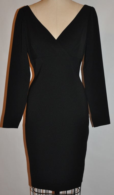 Badgley Mischka black cocktail dress is slight empire waisted. The back zipper measures 22