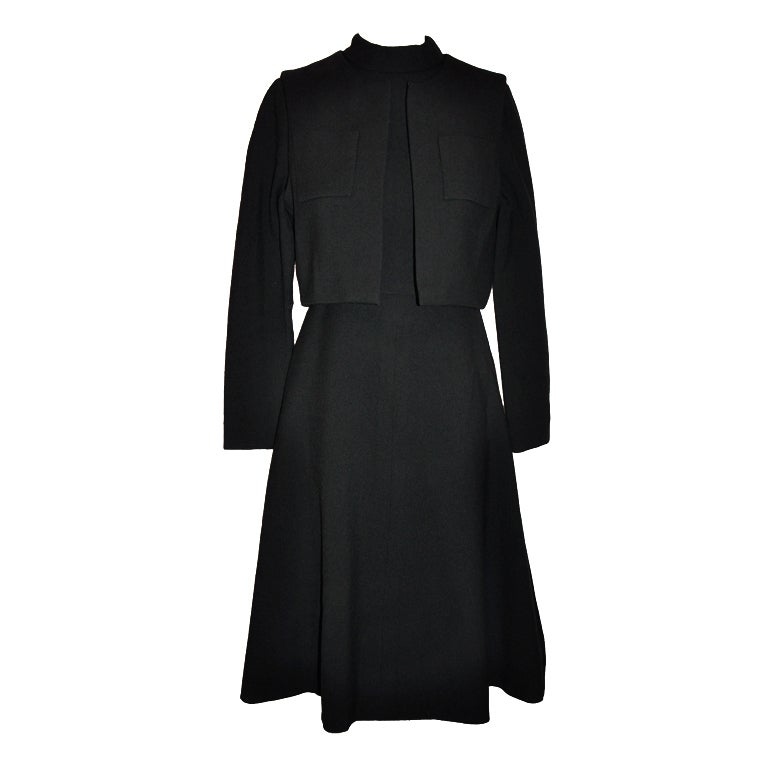 Black two-piece dress ensemble with cropped vest