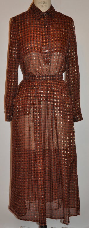 This wonderful sheer brown chiffon two-piece ensemble has dots of metallic gold threads throughout the outfit.  
  The blouse has four buttons in front. The front measures 20