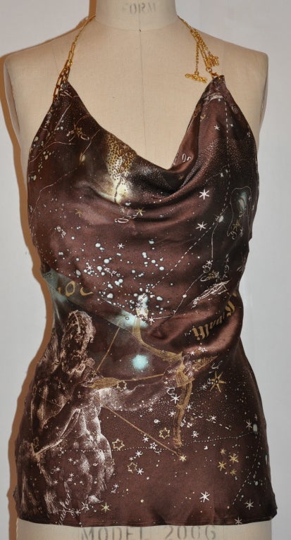 Roberto Cavalli brown silk halter has Astrology and the Universe print with gilded gold metal adjustable straps. The straps has two charms attached and measures 20