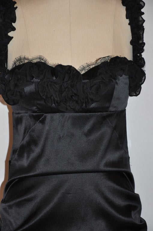 Roberto Cavalli black silk with spandex blend cocktail dress has a attched underwire bra with leopard print and imported hand-done Swiss lace detailing.
  The bra size is medium. The shoulder straps can be detached if desired for a 