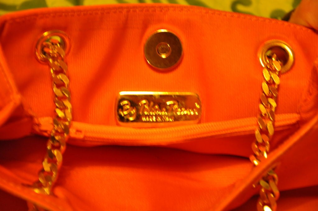This Paloma Picasso Tangerine shoulder bag has the Iconic 