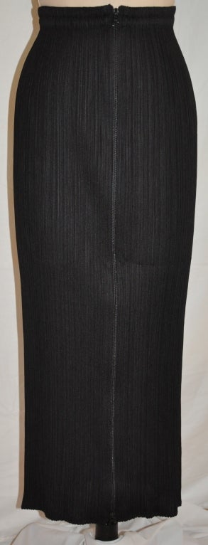 Issey Miyake maxi skirt has a zipper front styled with their signature pleated material.
   Waistline measures 26