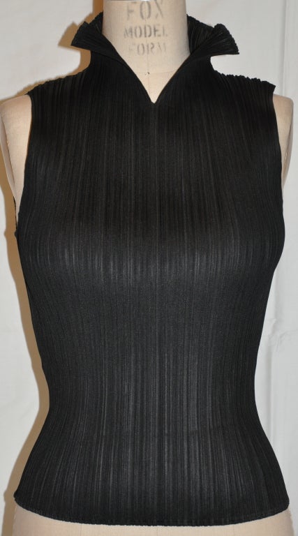 Issey Miyake signature pleated tank top styled with a high collar. Classic and timeless.
   The front length measures 18 1/4