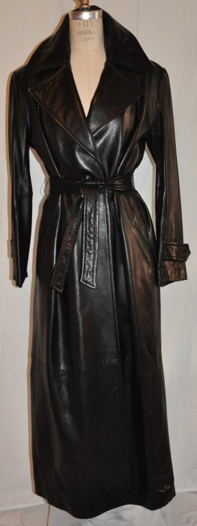 Donna Karan Black calf-skin leather floor-length wrap coat comes with a leather tie-belt. The belt measures 60
