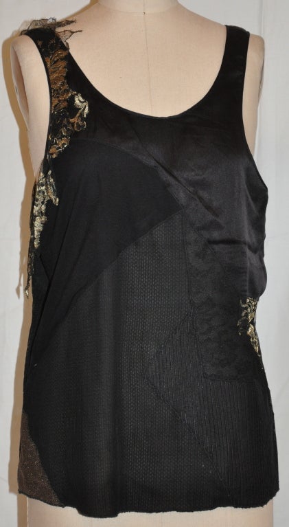 Katayone Adeli black silk evening top has soft patches of textured lace, metallic weaves and silks.
  The neckline and armhole are all finished with hand-rolled silk and handstitched piping.
  The front length measures 15 1/2